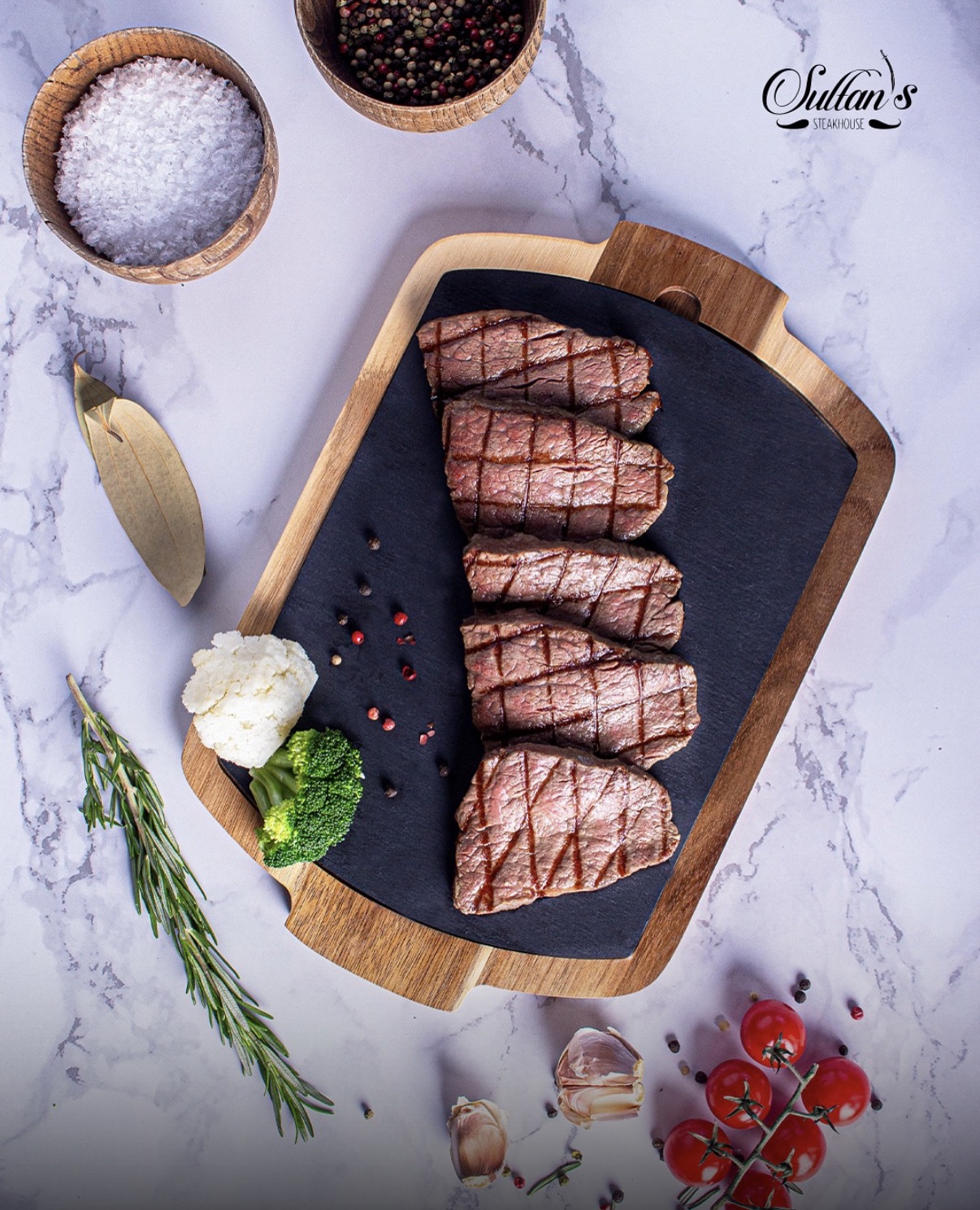 Sliced steak on a serving board